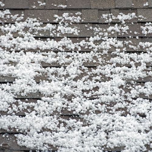 hailstones on a roof after a storm