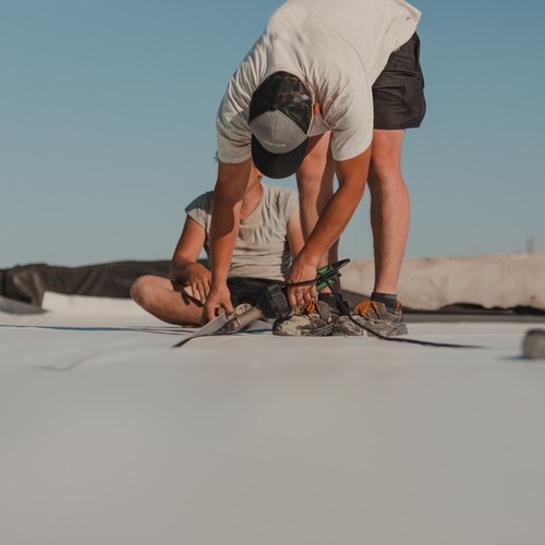 A Commercial Roofer Installs TPO Roofing