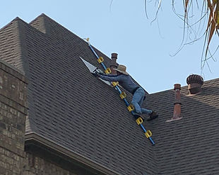 Roofer Repairing Roof.