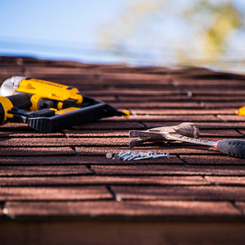 close-up of tools on a shingle roof